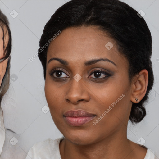 Joyful latino young-adult female with medium  brown hair and brown eyes