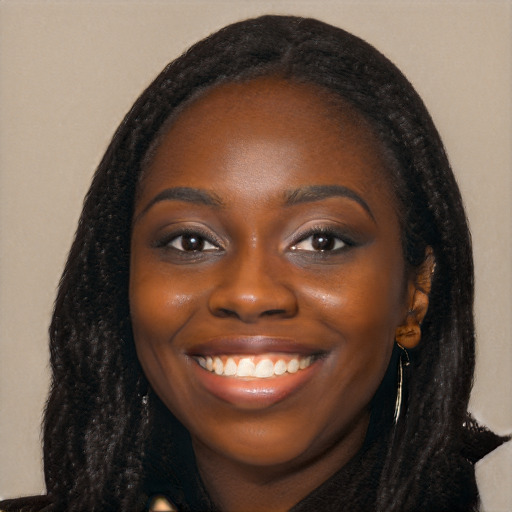 Joyful black young-adult female with long  black hair and brown eyes