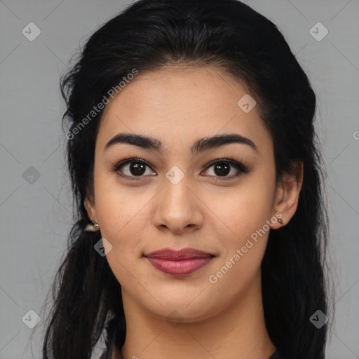 Joyful latino young-adult female with long  black hair and brown eyes