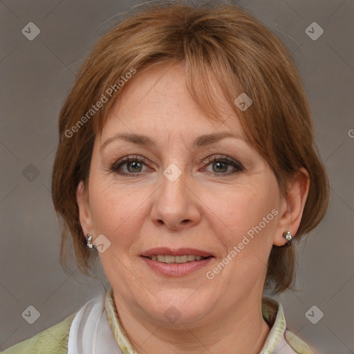 Joyful white adult female with medium  brown hair and grey eyes