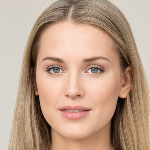 Joyful white young-adult female with long  brown hair and grey eyes