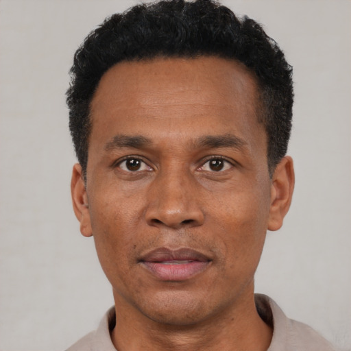 Neutral black adult male with short  black hair and brown eyes