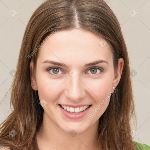 Joyful white young-adult female with long  brown hair and green eyes