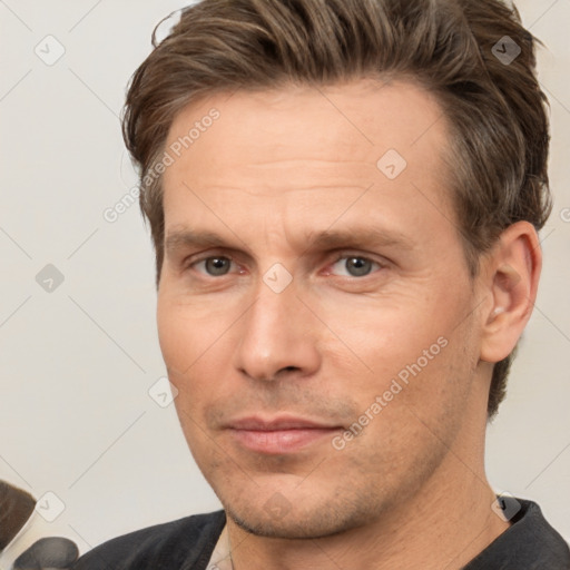 Neutral white adult male with short  brown hair and brown eyes