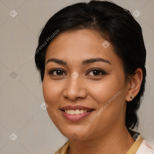 Joyful latino young-adult female with medium  brown hair and brown eyes