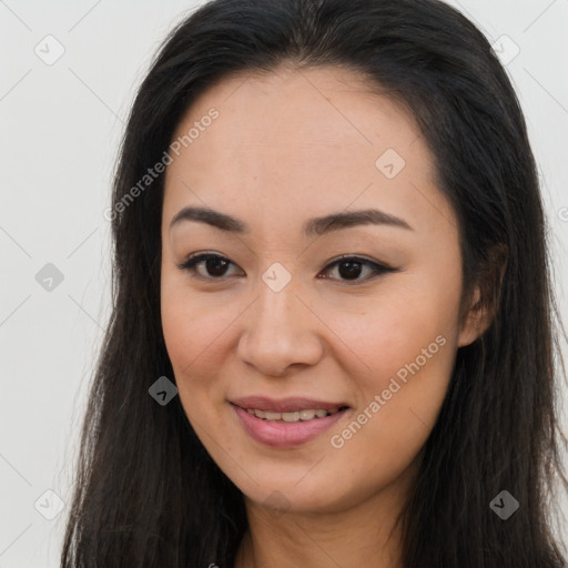 Joyful asian young-adult female with long  brown hair and brown eyes