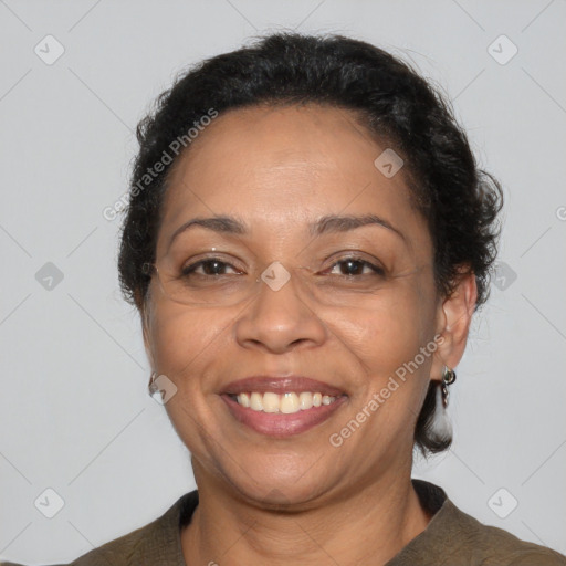 Joyful latino adult female with medium  brown hair and brown eyes