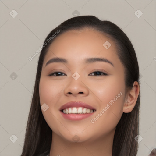 Joyful white young-adult female with long  black hair and brown eyes