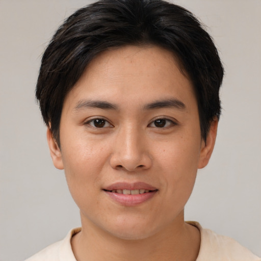 Joyful asian young-adult female with short  brown hair and brown eyes