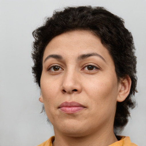Joyful white adult female with short  brown hair and brown eyes