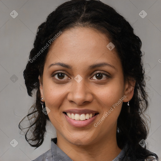 Joyful black young-adult female with medium  brown hair and brown eyes