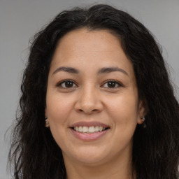 Joyful asian young-adult female with long  brown hair and brown eyes