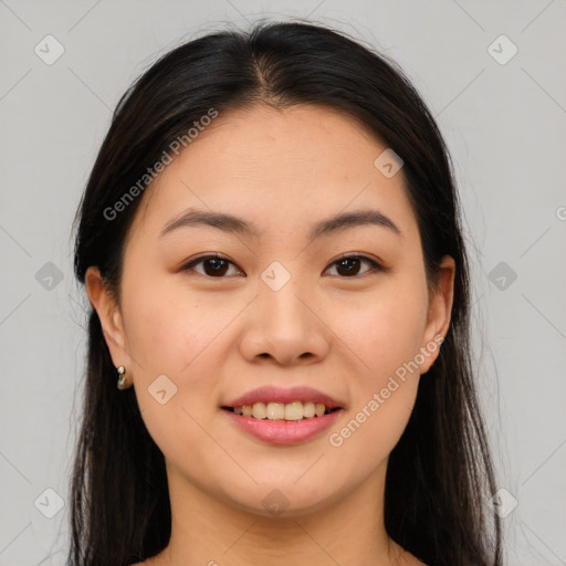 Joyful asian young-adult female with long  brown hair and brown eyes