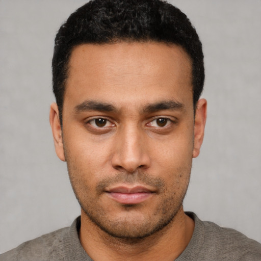 Neutral latino young-adult male with short  black hair and brown eyes