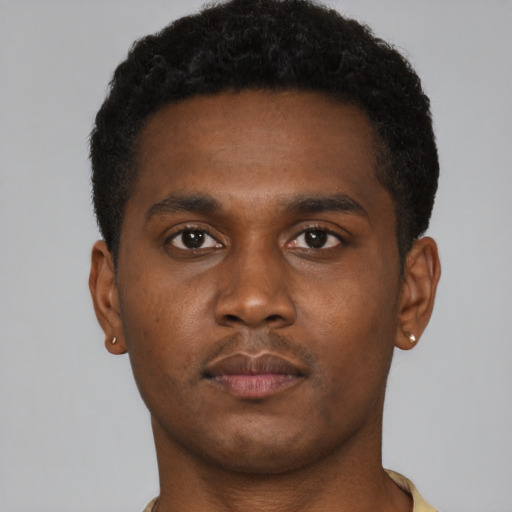 Neutral black young-adult male with short  brown hair and brown eyes