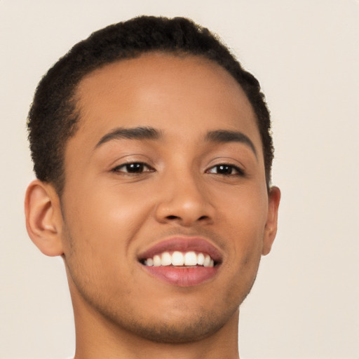 Joyful latino young-adult male with short  brown hair and brown eyes