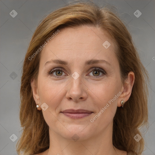 Joyful white adult female with medium  brown hair and grey eyes