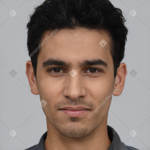 Joyful white young-adult male with short  black hair and brown eyes