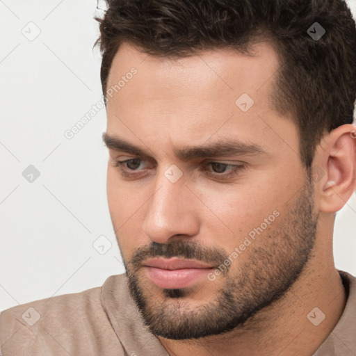 Neutral white young-adult male with short  brown hair and brown eyes