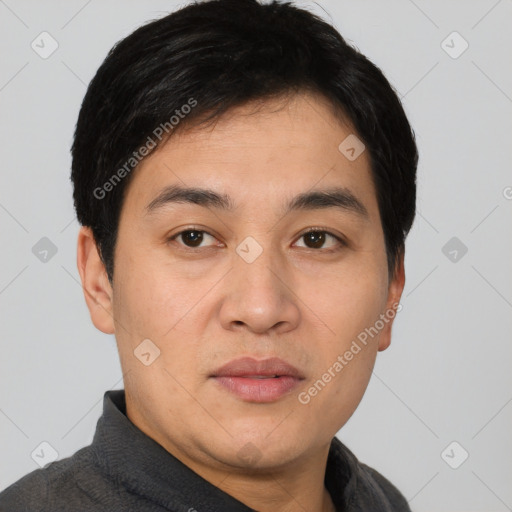 Joyful white young-adult male with short  black hair and brown eyes