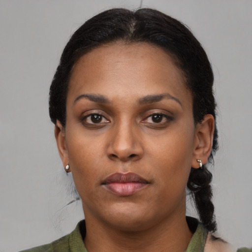 Neutral black young-adult female with medium  black hair and brown eyes