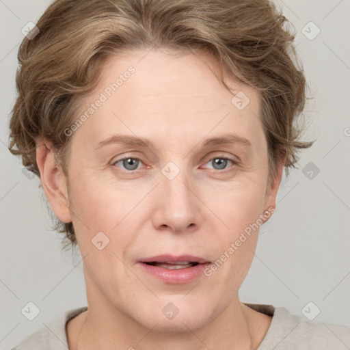 Joyful white adult female with short  brown hair and grey eyes