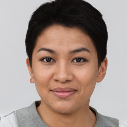 Joyful asian young-adult female with short  black hair and brown eyes