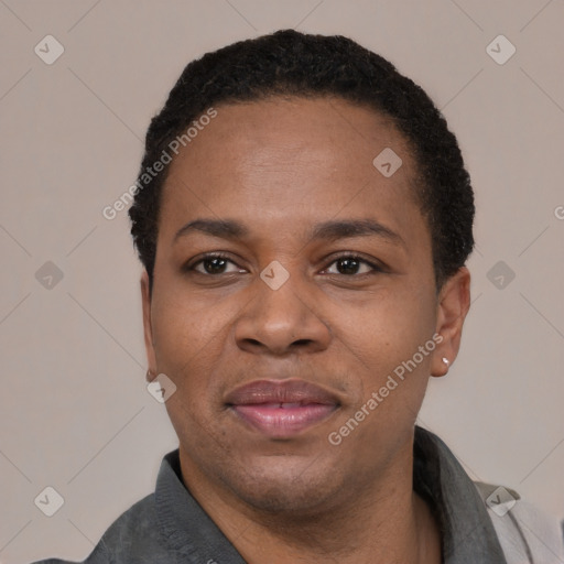 Joyful black adult male with short  black hair and brown eyes