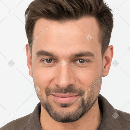 Joyful white young-adult male with short  brown hair and brown eyes