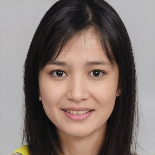 Joyful asian young-adult female with medium  brown hair and brown eyes