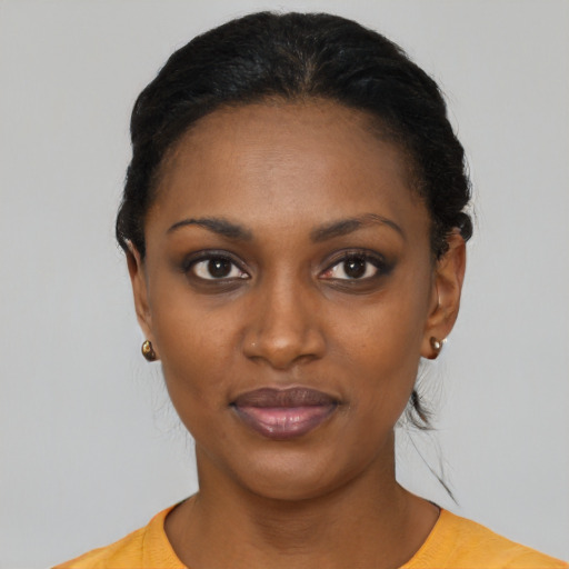 Joyful latino young-adult female with short  black hair and brown eyes