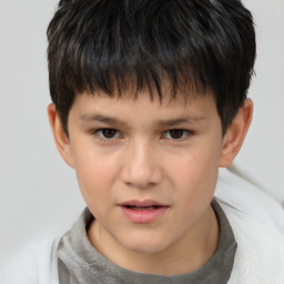 Joyful white child male with short  brown hair and brown eyes