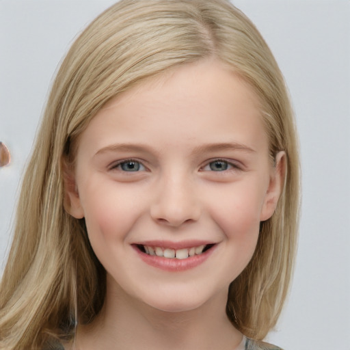 Joyful white child female with long  brown hair and blue eyes