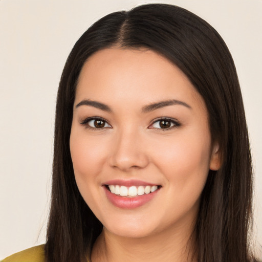 Joyful white young-adult female with long  brown hair and brown eyes