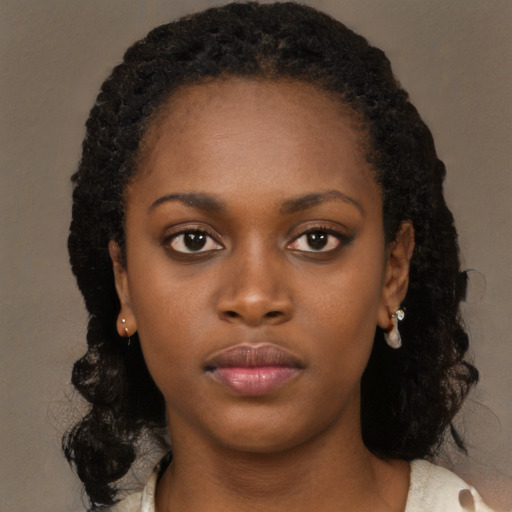 Neutral black young-adult female with long  black hair and brown eyes