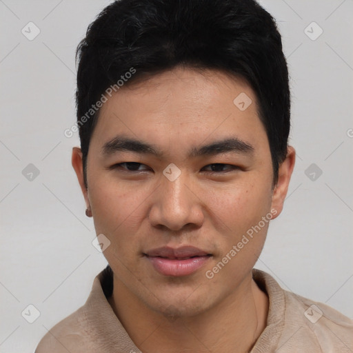 Joyful asian young-adult male with short  black hair and brown eyes