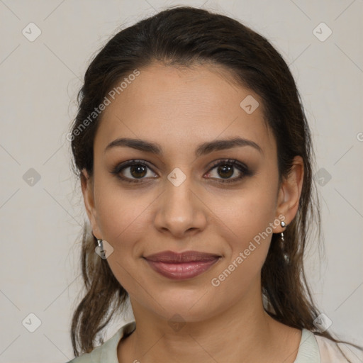 Joyful latino young-adult female with medium  brown hair and brown eyes