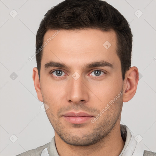 Neutral white young-adult male with short  brown hair and brown eyes