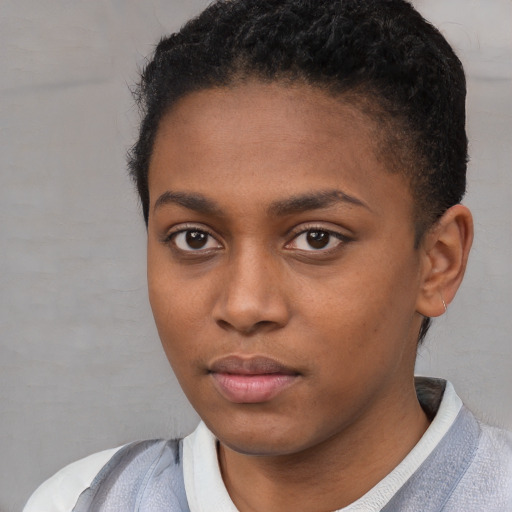 Neutral black young-adult female with short  black hair and brown eyes