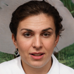 Joyful white adult female with short  brown hair and brown eyes