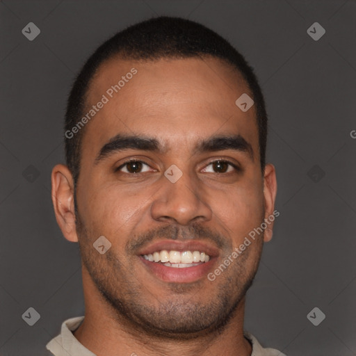 Joyful black young-adult male with short  brown hair and brown eyes