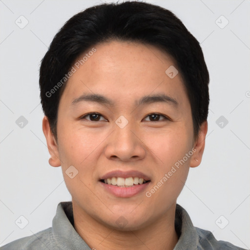 Joyful asian young-adult male with short  black hair and brown eyes