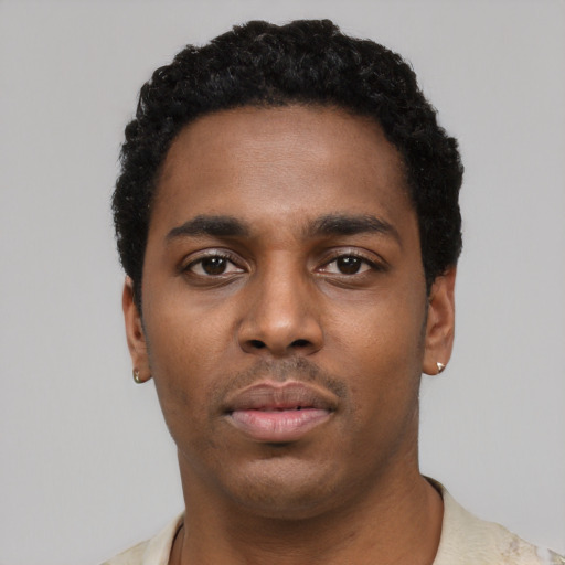 Neutral black young-adult male with short  black hair and brown eyes