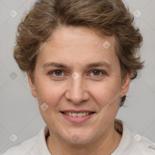 Joyful white adult female with short  brown hair and brown eyes