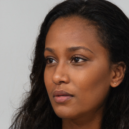 Neutral black young-adult female with long  black hair and brown eyes