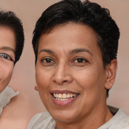 Joyful latino adult female with short  brown hair and brown eyes