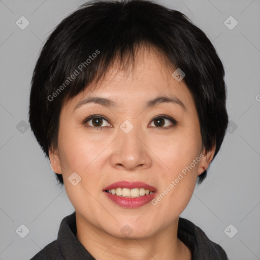 Joyful asian young-adult female with short  brown hair and brown eyes