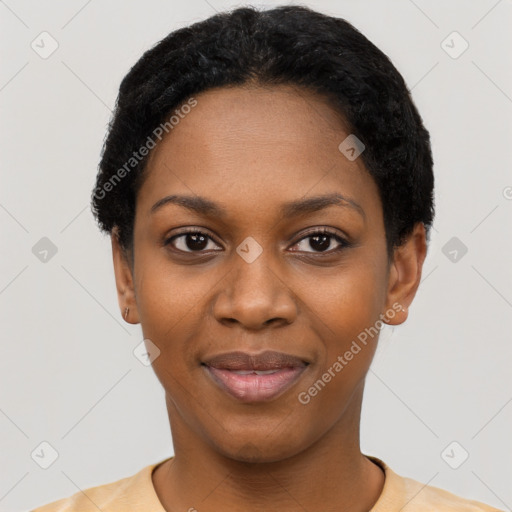 Joyful black young-adult female with short  black hair and brown eyes