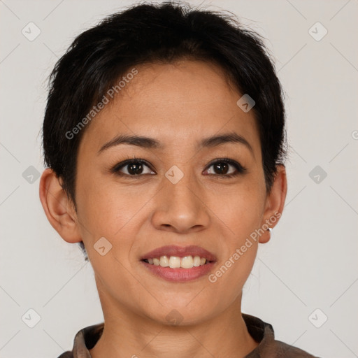 Joyful latino young-adult female with short  brown hair and brown eyes