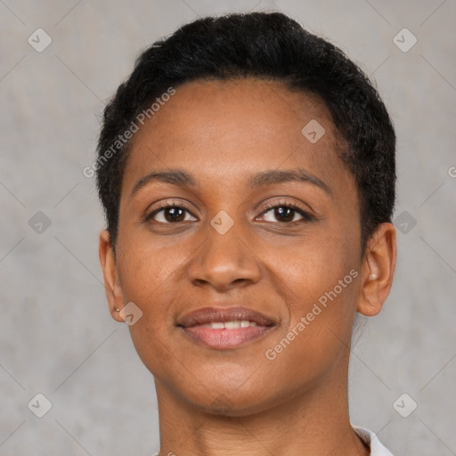 Joyful black young-adult female with short  brown hair and brown eyes